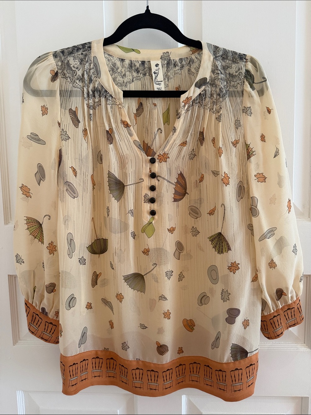 Anthropologie: Floreat Cream Sheer Blouse with Autumn Umbrella & Hat Print